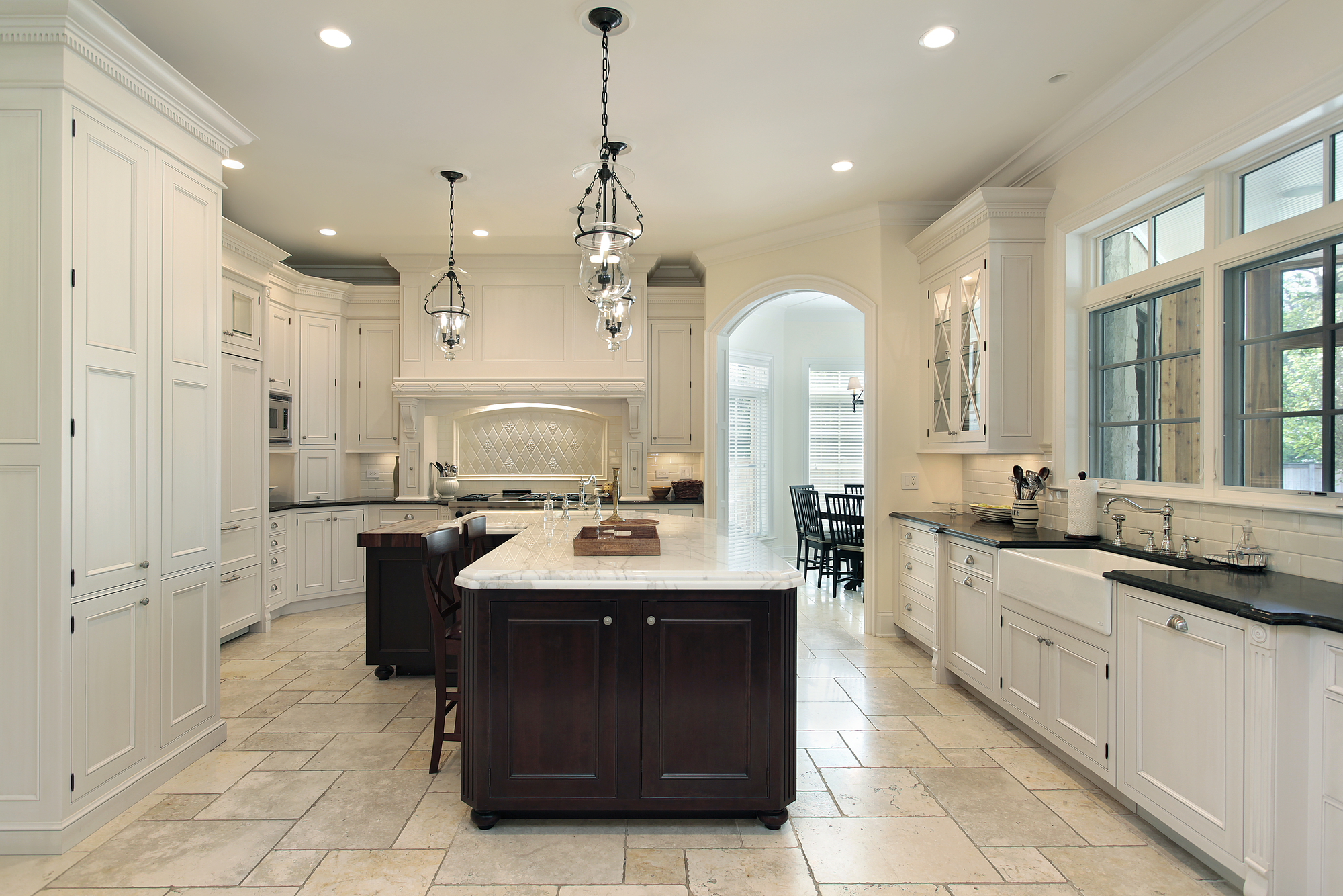 A Bright Kitchen Featuring a Center Island and Warm Wooden Floors